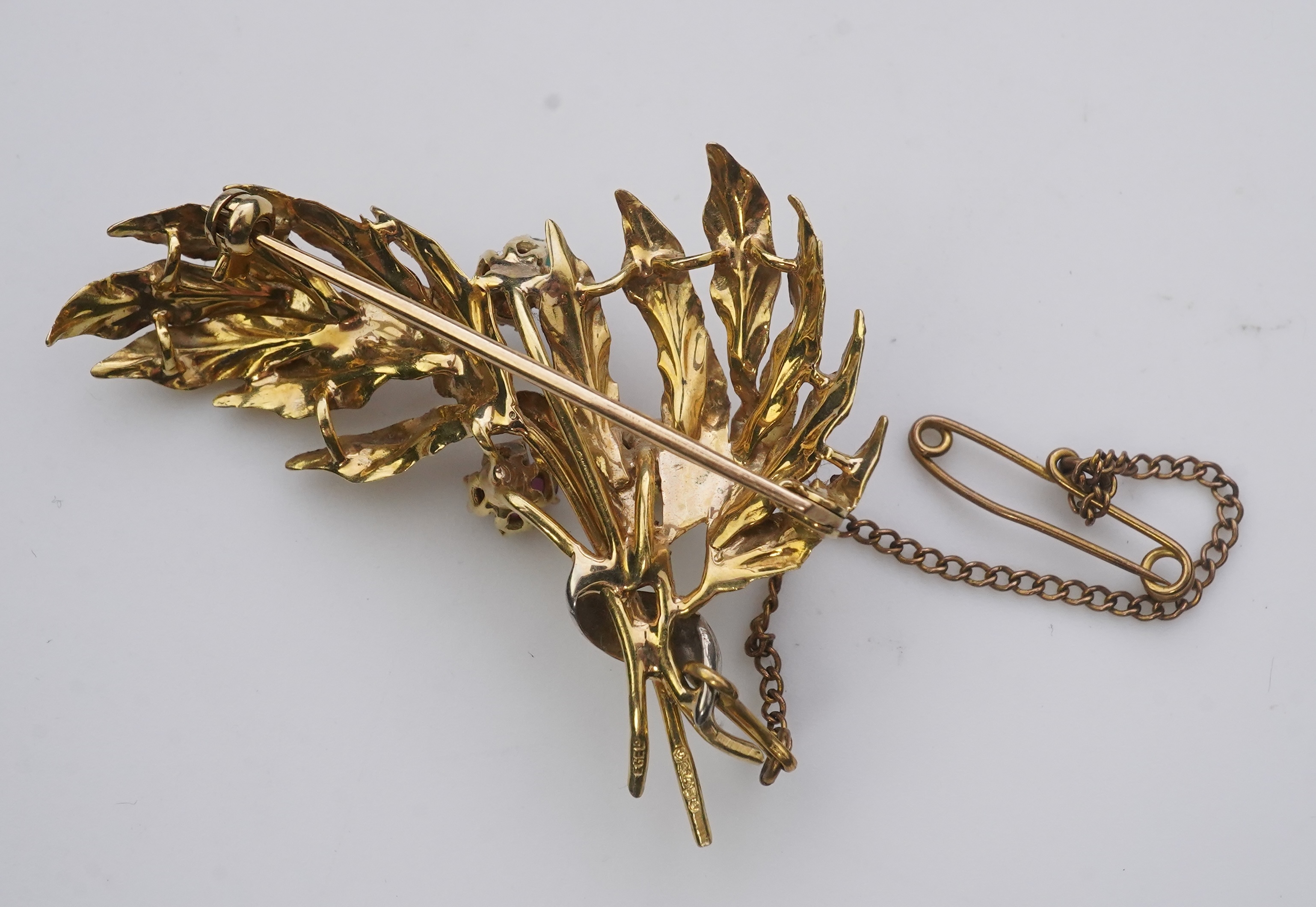 A collection of three brooches and a pendant, 19th and 20th century